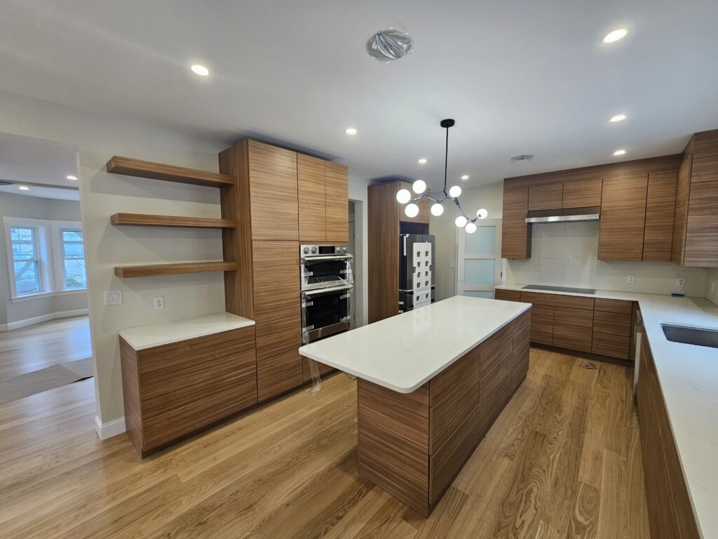 Wood grain cabinets that are horizontal with a white countertop