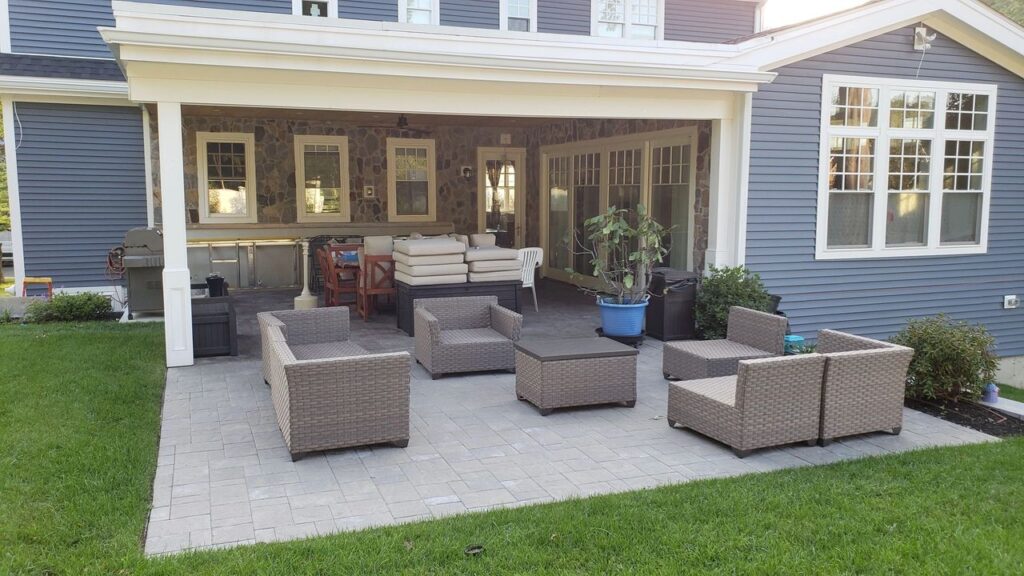 Outdoor terrace and outdoor kitchen with stamped concrete floor