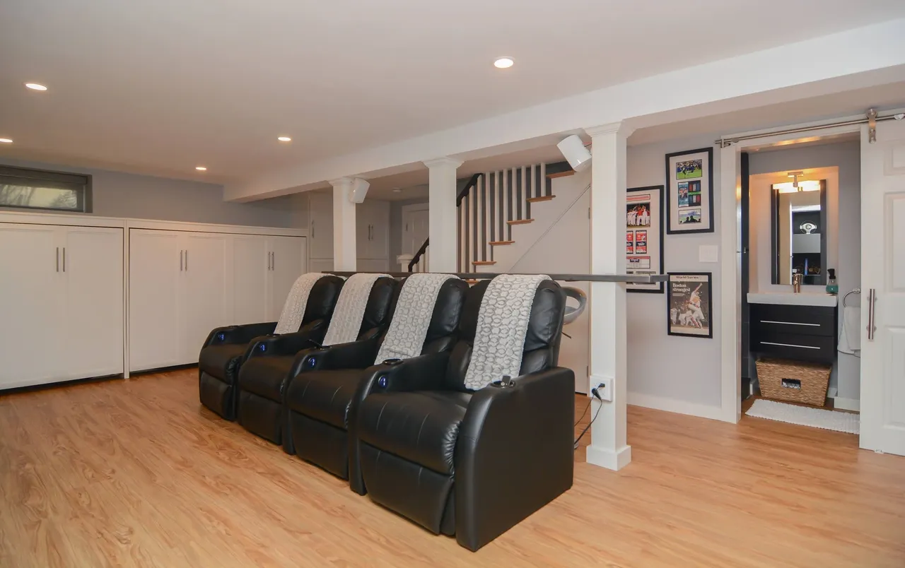 Basement remodel with theatre seating and custom entertainment system