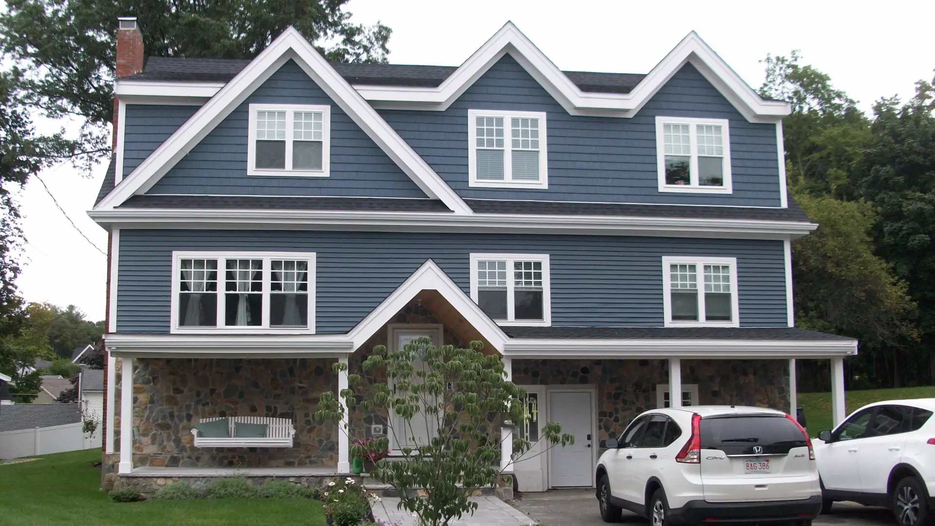 2nd Story Addition, blue siding with white trim. Gable front, 2.5 stories