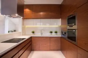 Contemporary kitchen with flat wood semigloss cherry cabinets
