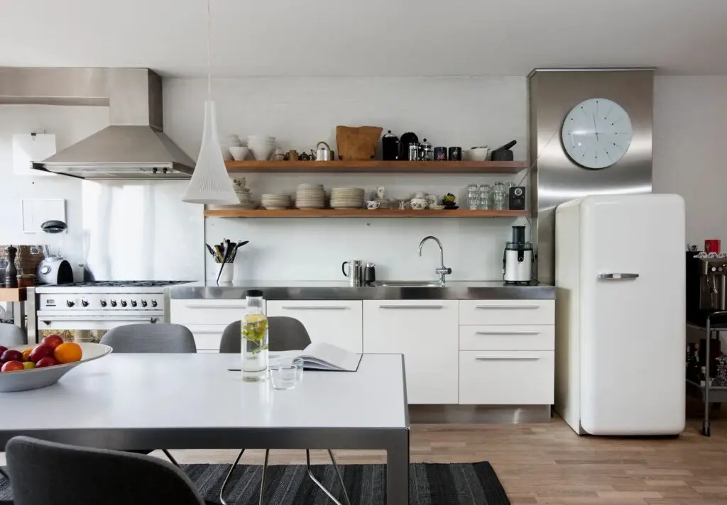 Smaller kitchen with white appliances a bit retro 