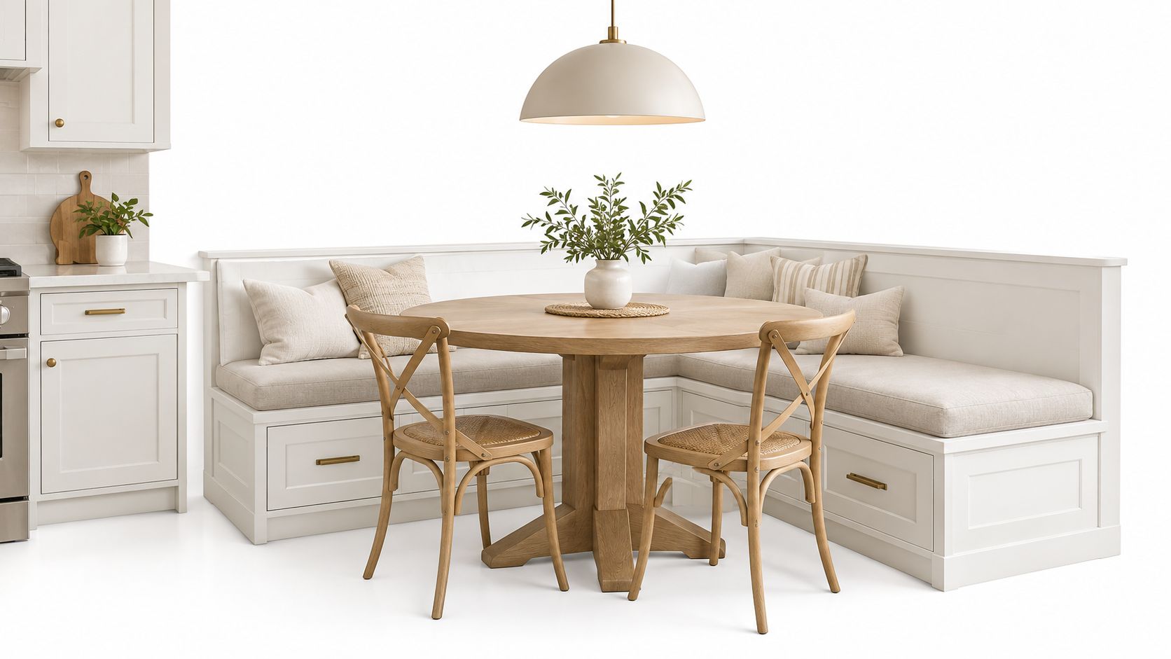 A bright, modern kitchen breakfast nook featuring a built-in white corner bench, round wooden table, and chairs.